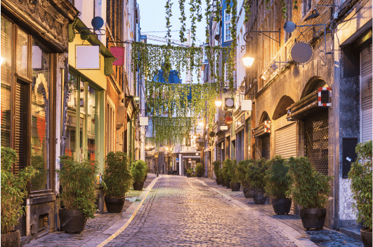 An illuminated street in Dublin at dusk